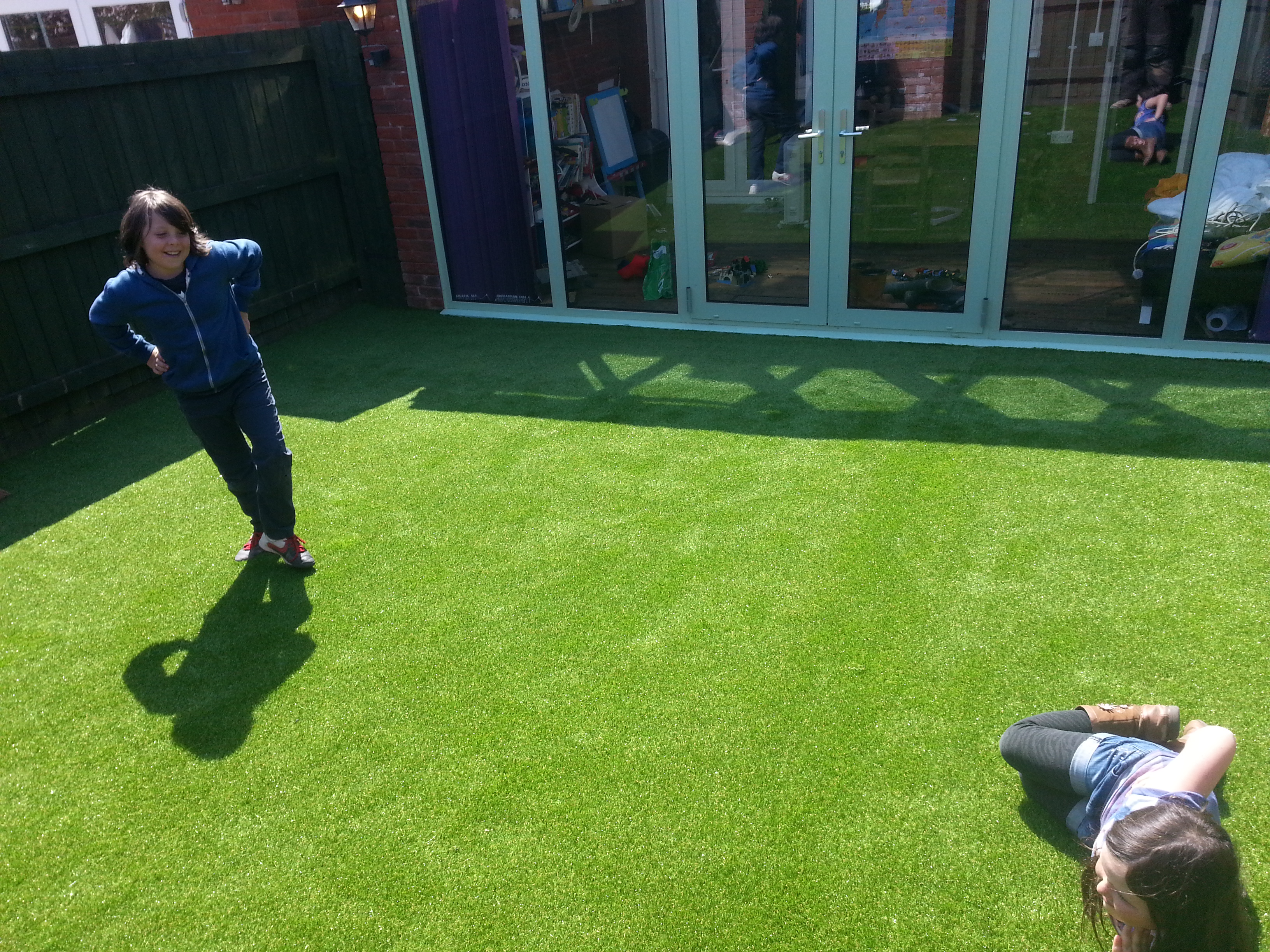 Artificial grass with children playing