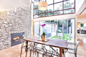 inside outside living with bifold doors and dry stone wall cladding